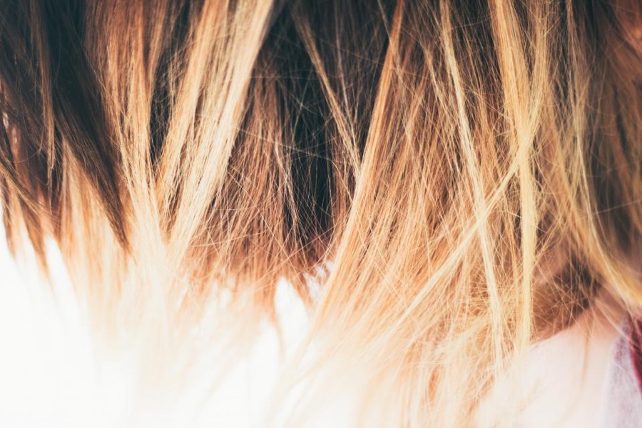 Close-up of brown hair fading to blonde at the ends