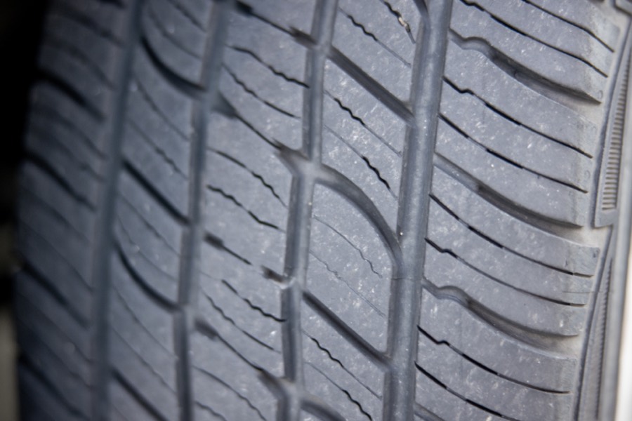 Close-up of a car tire's tread grooves