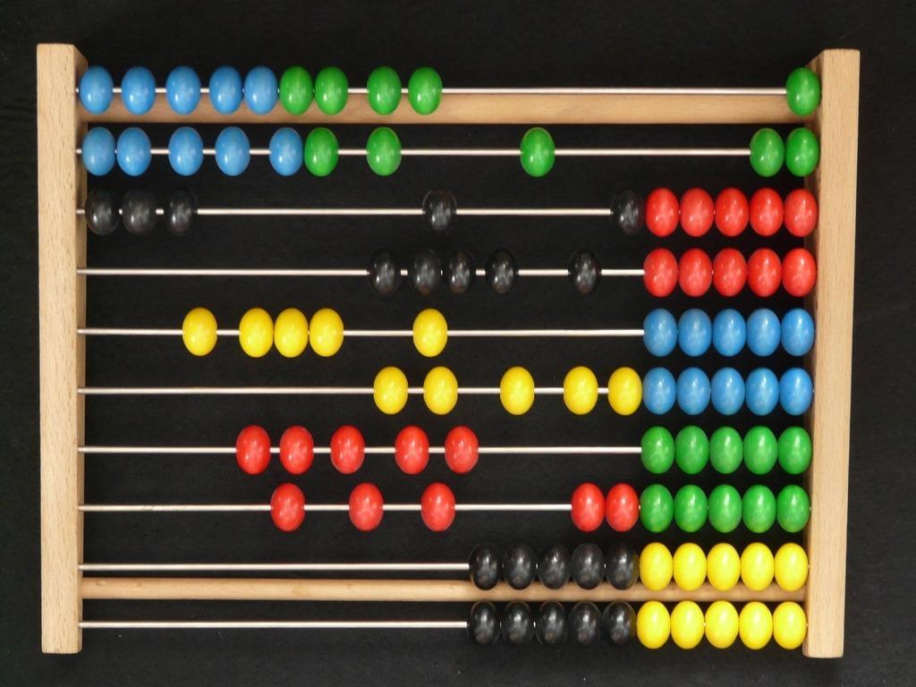 A wooden bead frame with rows of coloured beads on wires