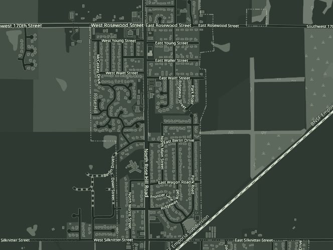 Street map of Rose Hill, Kansas, at night tones, with a pin in open country east of town marking the barn