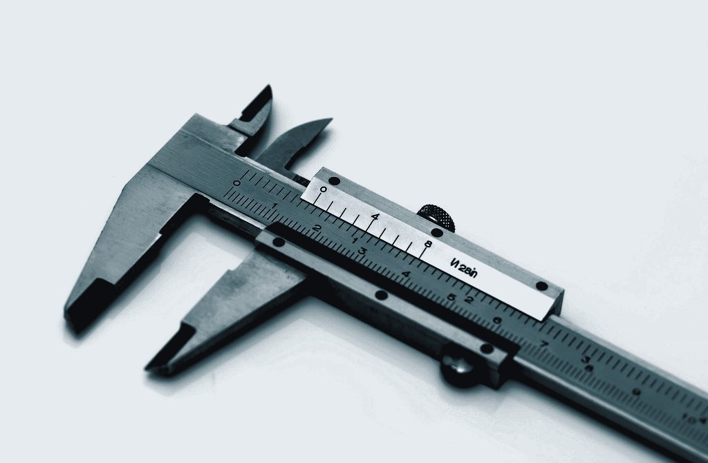 Close-up of a steel vernier caliper with its jaws open